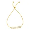 ADORNIA 14K GOLD PLATED BOLO BRACELET WITH BAGUETTE CRYSTAL BAR