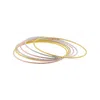 Adornia 14k Gold Plated Tri-color Skinny 7-piece Bangle Set In Gold