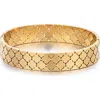 Adornia 18k Gold Plated Quatrefoil Hinged Bangle Bracelet In Gold