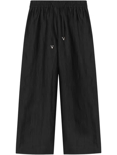 Aeron Gilbert Trousers In Black