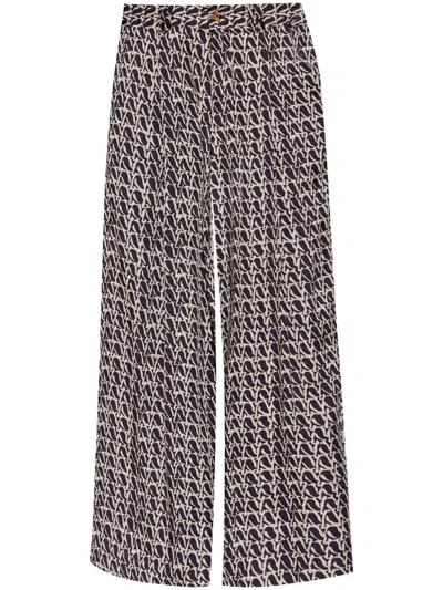 AERON WELLEN MONOGRAM-PRINT TROUSERS
