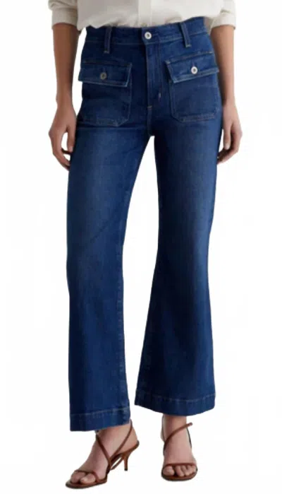 Ag Bonnie-mid Rise Relaxed Flare Jean In Shallow In Blue