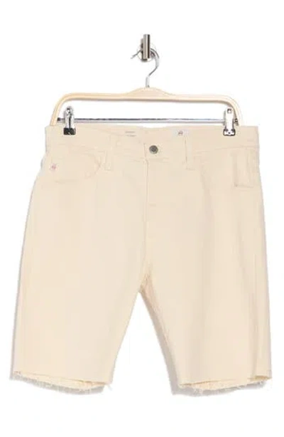 Ag Everett Raw Hem Denim Shorts In Sand