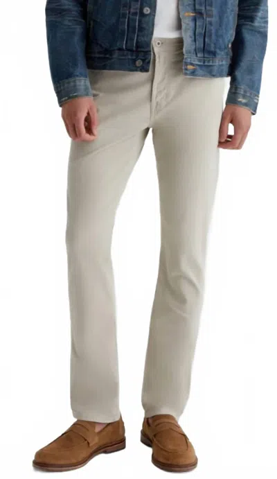 Ag Everett Slim Straight Sueded 34 In Seam Jeans In Beige In Gray