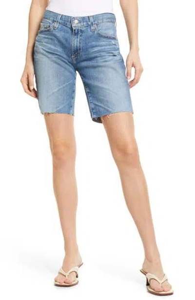 Ag Nikki Raw Hem Denim Bermuda Shorts In Blue