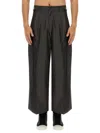 Aïe Pleated Cotton Trousers In Black