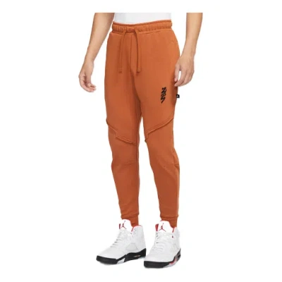 Air Jordan Men's  Zion Performance Alphabet Embroidered Solid Color Bundle Feet Sports Brown Pants In Orange