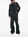 Airei Frayed Embroidered Denim Jacket In Black