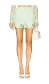 Aknvas X Revolve Juli Mini Skirt In 人工树脂绿