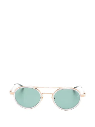 Akoni Oval Frame Sunglasses In Gold