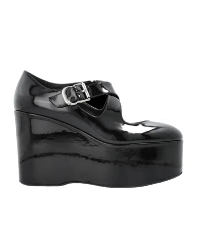 ALAÏA 110MM WEDGES LEATHER PUMPS