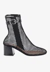 Alaïa 55 Fishnet Ankle Boots In Black