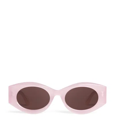 Alaïa Acetate Oval Sunglasses In Pink