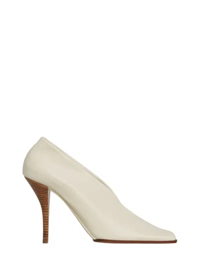 ALAÏA BEIGE SLIP-ON PUMPS