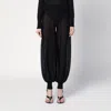Alaïa Fringed Knit Jogger Pants In Black