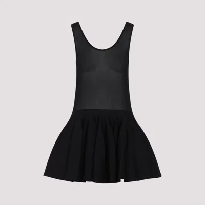 Alaïa Knitted Minidress In Noir Alaia