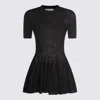 Alaïa Ultra Fine Wool Merino Peplum Top Clothing In Black