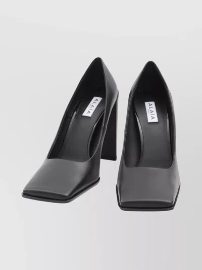 ALAÏA BLOCK HEEL SQUARE TOE PUMPS