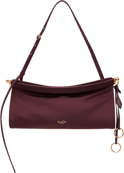 Alaïa Medium Leather Le Click East West Shoulder Bag In Burgundy