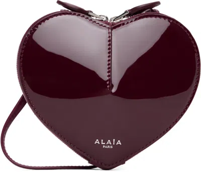 Alaïa Le Coeur Patent Leather Crossbody Bag In Burgundy
