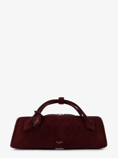 ALAÏA CLUTCH LE TECKEL SUEDE HANDBAG