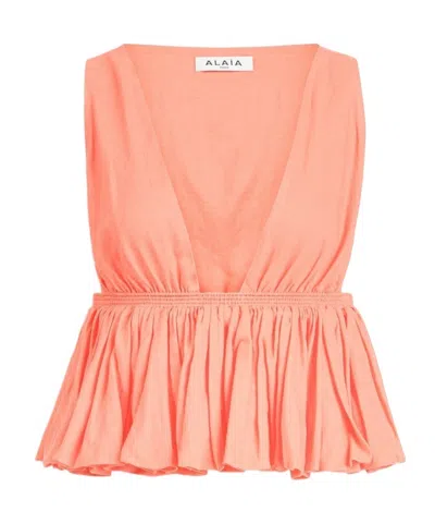 Alaïa Cotton Linen Blend Peplum Top In Orange