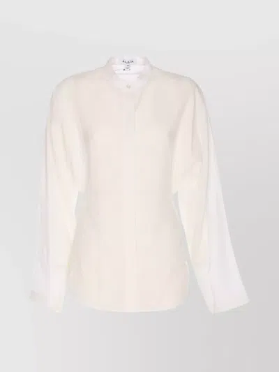 Alaïa Curved Stand Collar Long Sleeve Top In Nude