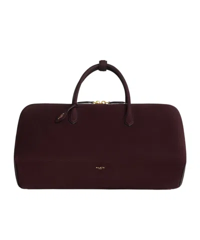 Alaïa Delta Medium Bag In Nubuck In Bordeaux Red