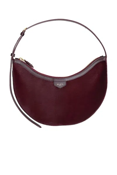 Alaïa Demi Lune Haircalf Bag In Burgundy