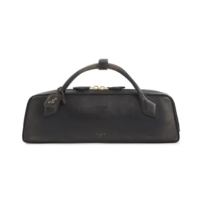 Alaïa Alaia Ebony Dachshund Clutch With Gold Logo In Brown