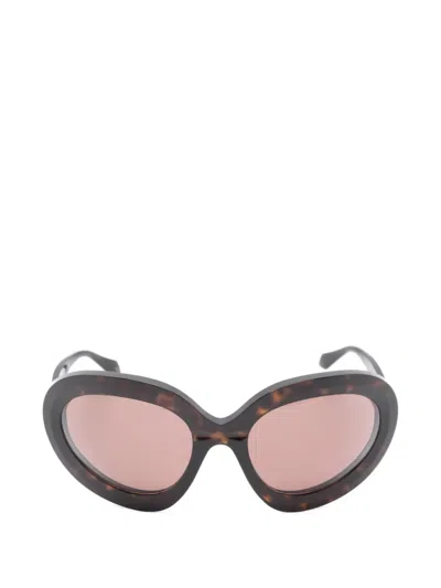 Alaïa Eyewear Sonnenbrille Mit Ovalem Gestell In Schwarz