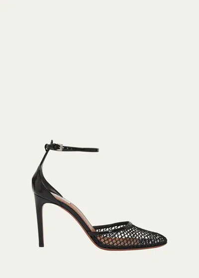 ALAÏA FISHNET PATENT ANKLE-STRAP PUMPS