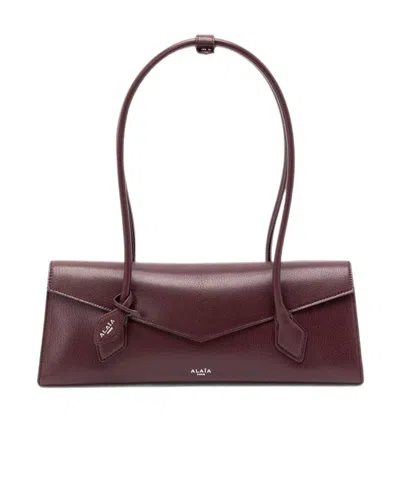 Alaïa Flap Shoulder Bag In Red