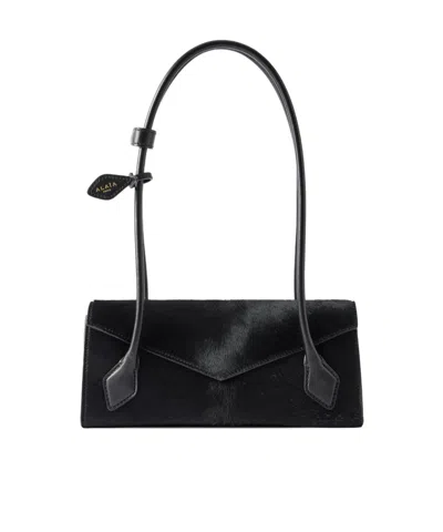 Alaïa Flap Strap Shoulder Bag In Black