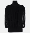 Alaïa Fringed Wool Sweater In Black