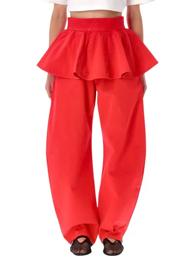 Alaïa Alaia Garment-dyed Denim Peplum Belt With High-rise Flared Silhouette In Rosso