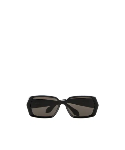 Alaïa Geometrically Framed Sunglasses In Black