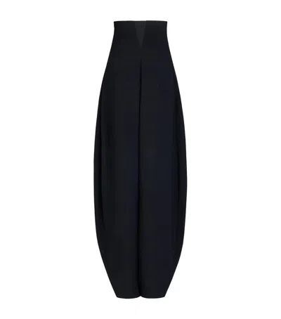 Alaïa High-rise Curved-leg Trousers In Black