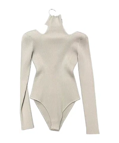 Alaïa Hollow Knitted Jumpsuit In Nude