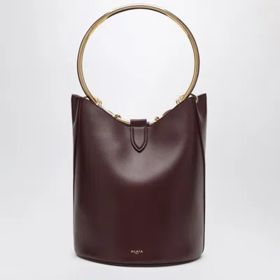 ALAÏA ALAIA LARGE CHOCOLATE-COLOURED LEATHER RING BUCKET BAG WOMEN