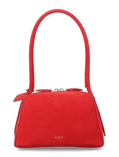 Alaïa Alaia Le Bouledogue Mini Nubuck Leather Handbag With Diagonal Tubular Handle In Red