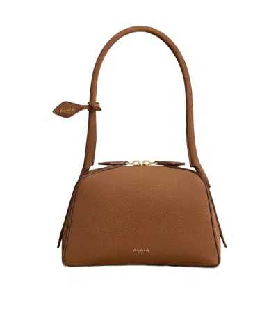 Alaïa Le Bouledogue Small Bag In Nubuck In Brown
