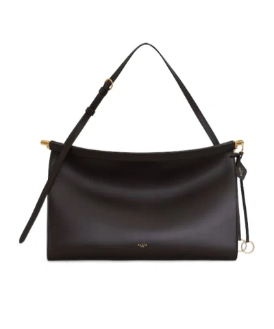 Alaïa Le Click East West Large Bag In Leather In Dark Brown