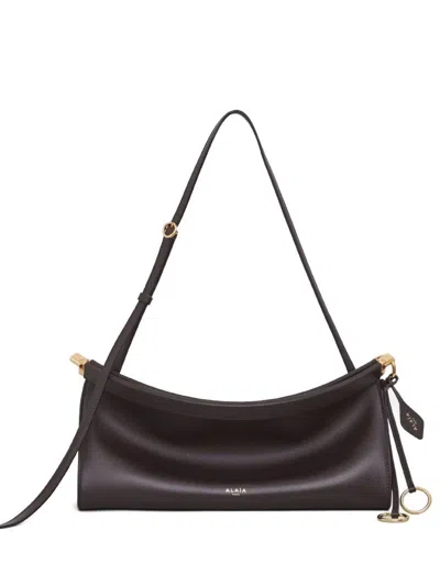 Alaïa Le Click East West Mediaum Leather Shoulder Bag In Brown