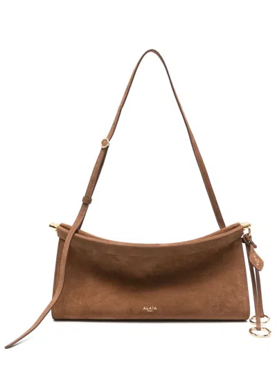 Alaïa Le Click East West Medium Leather Shoulder Bag In Brown