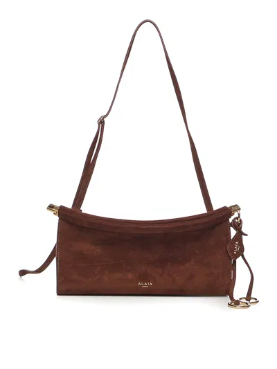 Alaïa Le Click East West Small Suede Bag In Brown