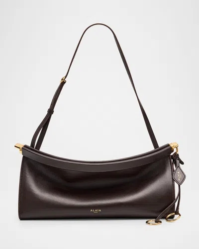 ALAÏA LE CLICK MEDIUM SHOULDER BAG IN GLOSSY LEATHER