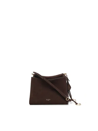 ALAÏA LE CLICK MINI BAG IN NUBUCK