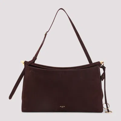 Alaïa Le Click Pocket 35 Bag In Nubuck In Black