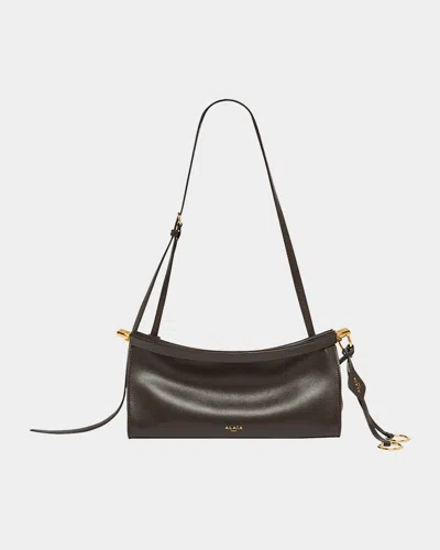 ALAÏA LE CLICK SMALL SHOULDER BAG IN GLOSSY LEATHER